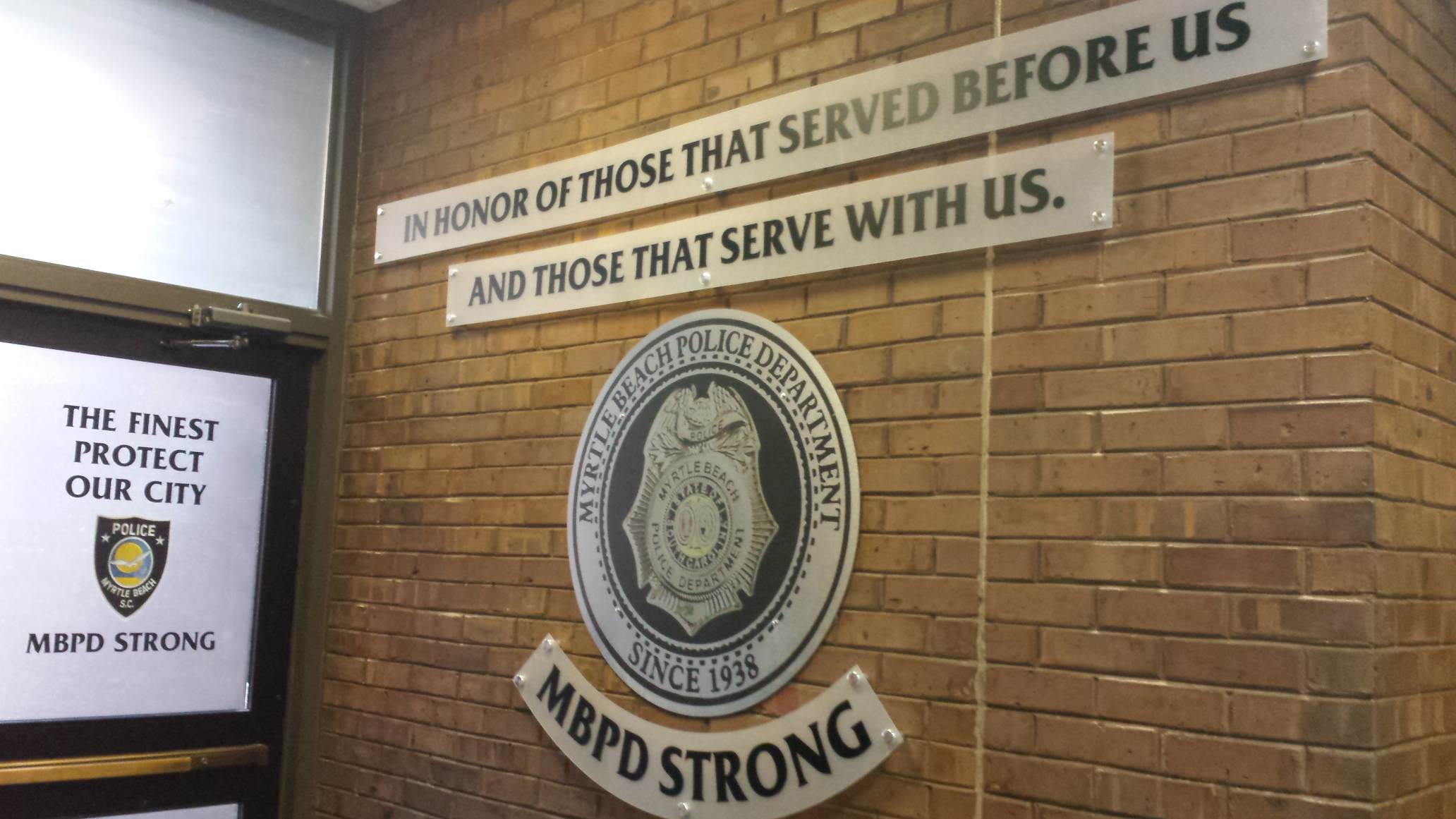 Police department wall with honor plaques