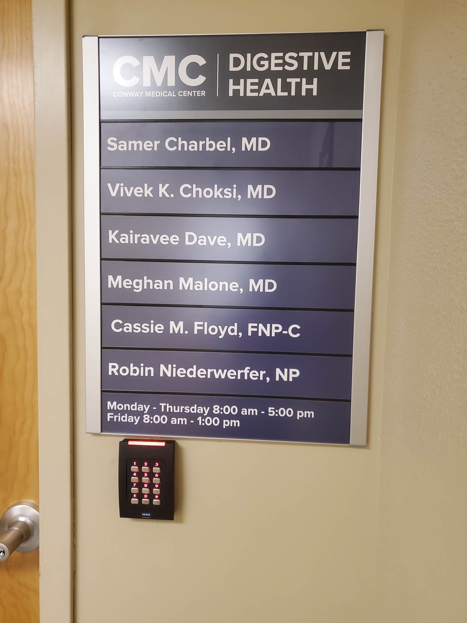 Clinic hours and staff directory on door