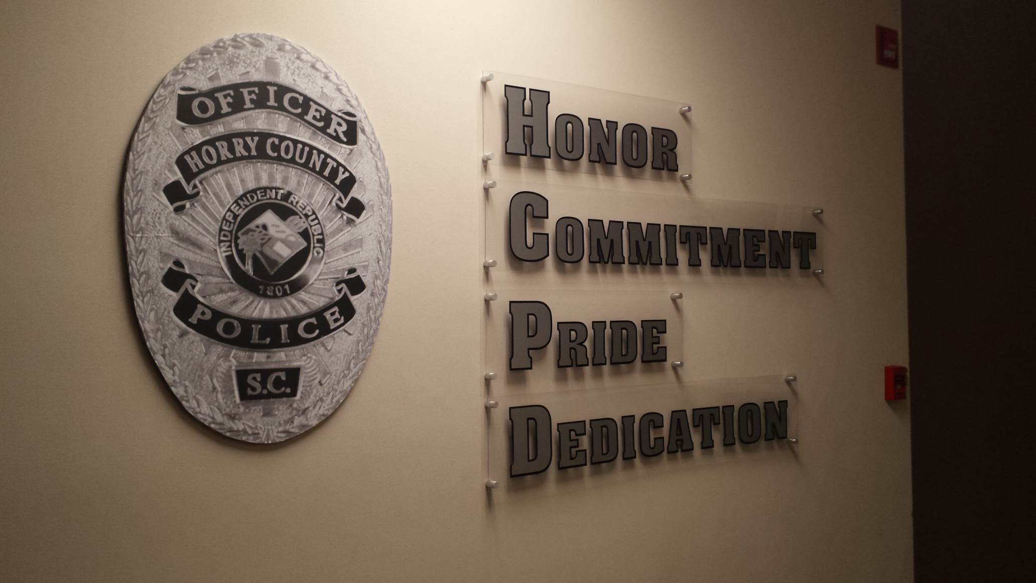 Police badge and motivational words display