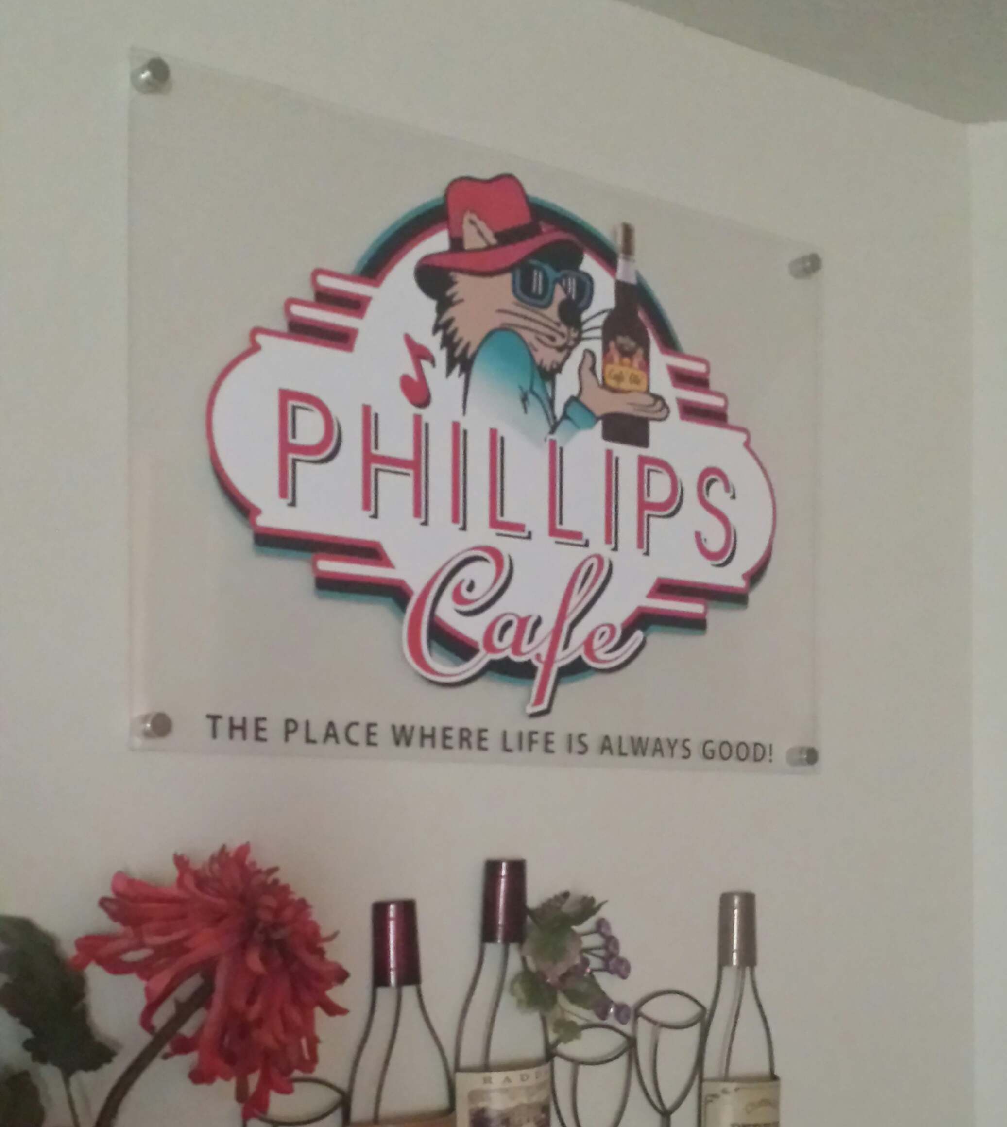 Decorative cafe sign with flowers